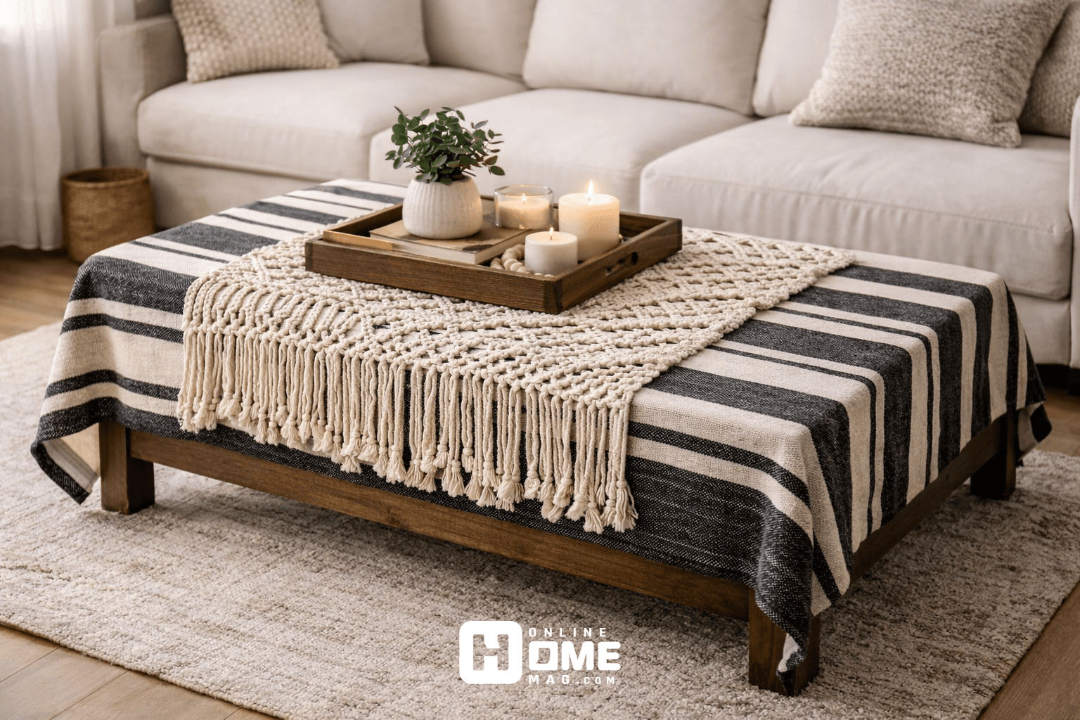 A coffee table featuring a bold geometric striped cloth in black and white
