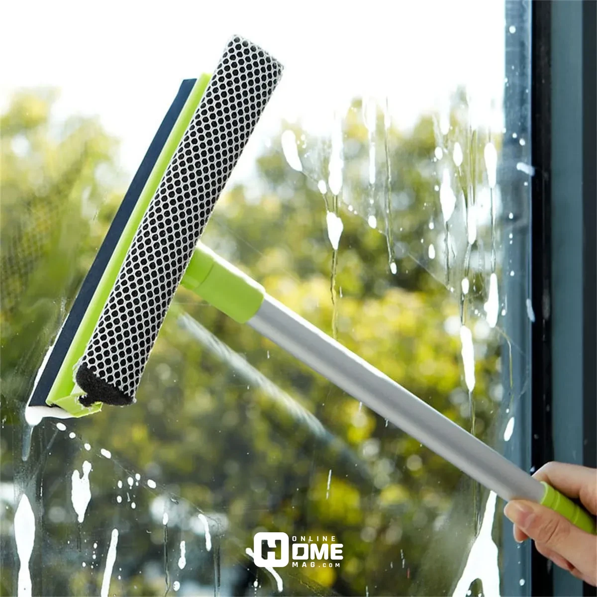 A window cleaning scrubber in action, removing dirt and grime from glass."