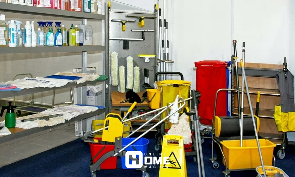 "Various professional cleaning equipment including mops, buckets, detergents, and carts stored in a cleaning supply room."
