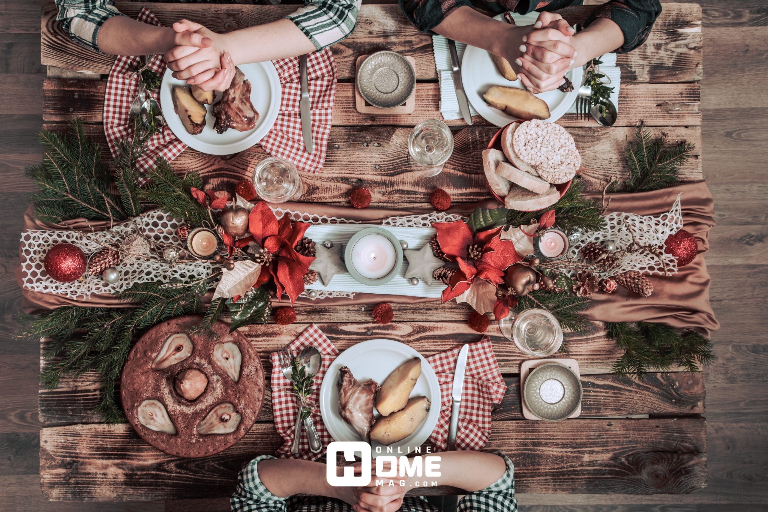 "A festive Christmas table setting for four, beautifully decorated with holiday-themed ornaments, candles, and a delicious spread of food, creating a warm and inviting atmosphere for a joyful meal."