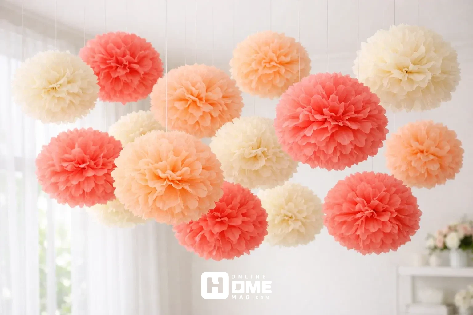 Multiple tissue paper pom-poms in coral, peach and cream colors 